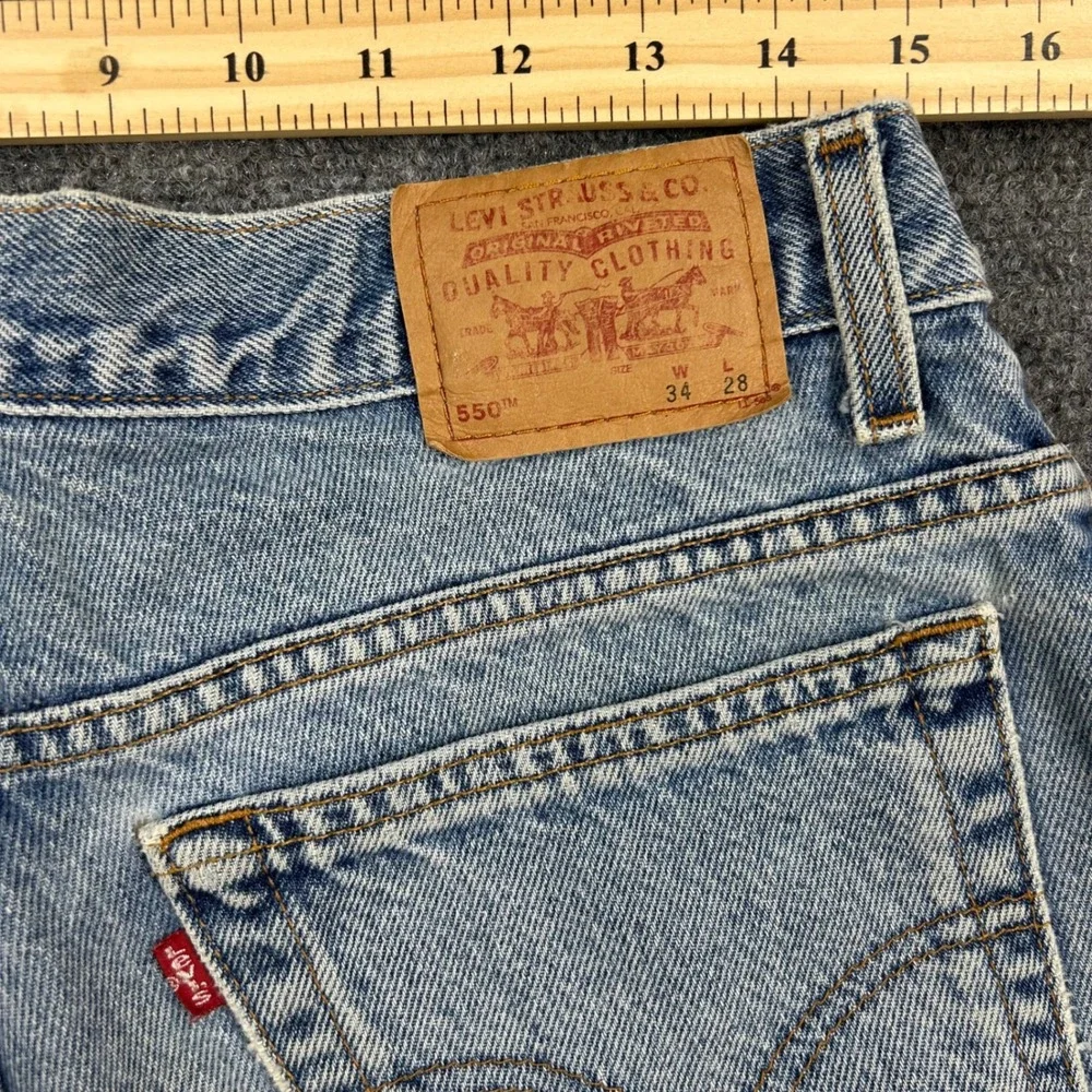 Vintage Levis 550 Relaxed Fit Husky Jeans Mens Size 34x28 Light Wash Denim Pants